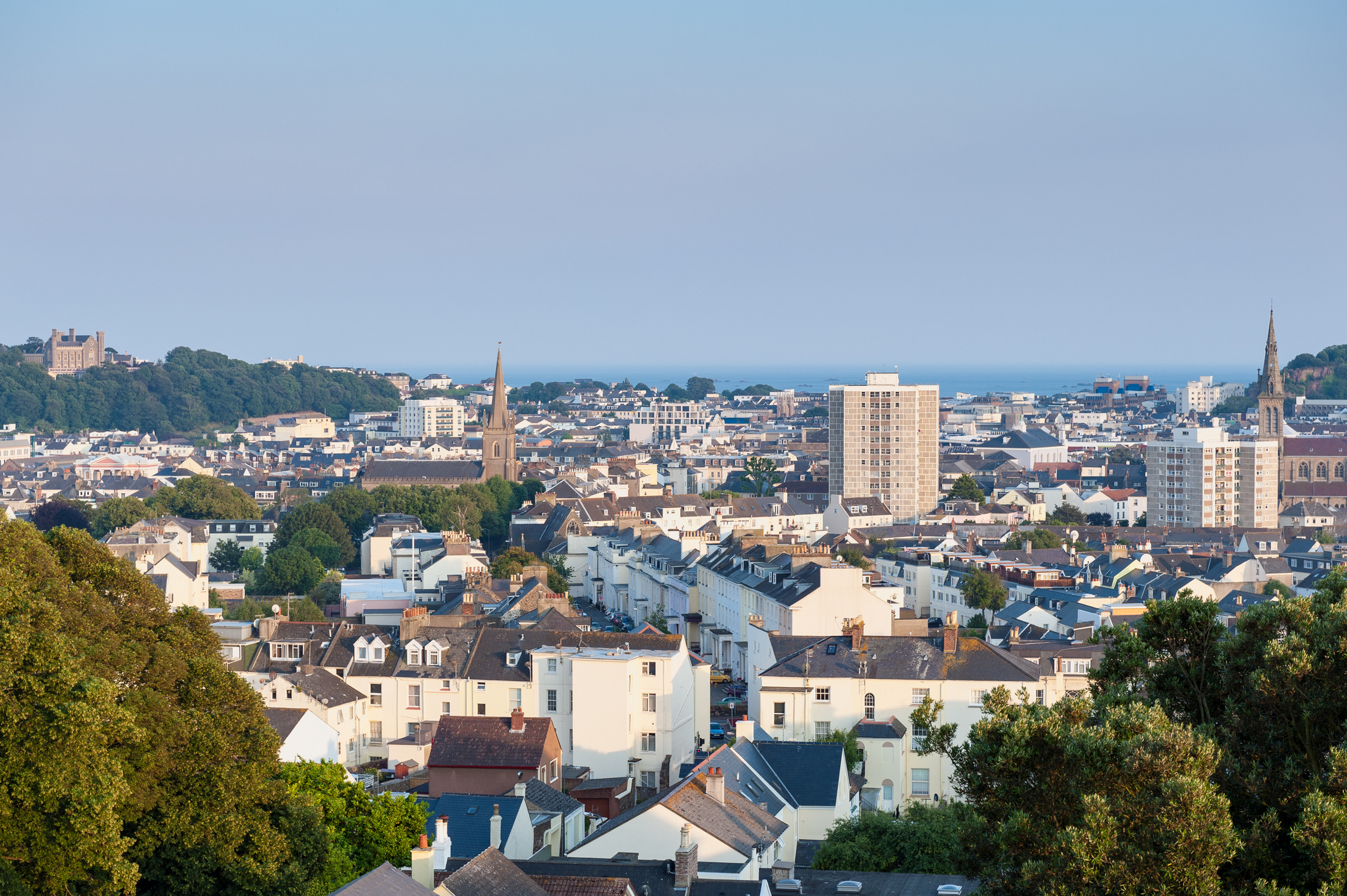 View over Saint Helier, capital of Jersey, Channel Islands, UK on summer evening around sunset.