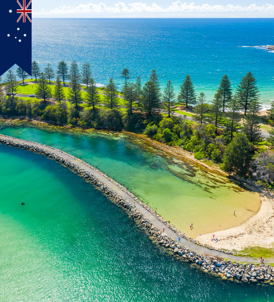 A view of the sea in Australia with an island with trees on