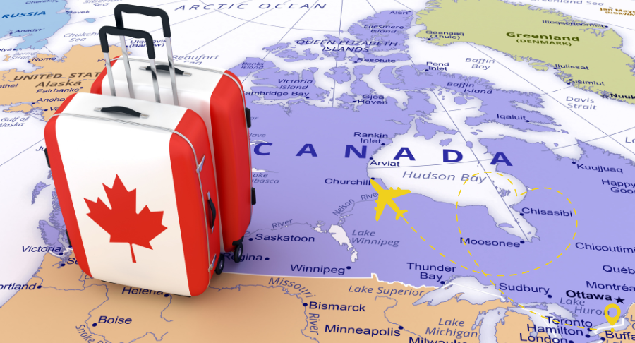 A map of Canada with some suitcases with the Canadian flag printed on
